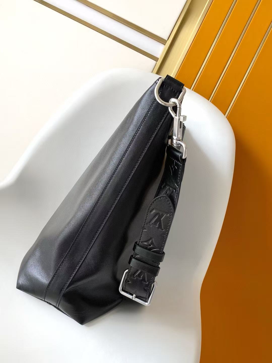 LV SHOULDER BAG 48 IN BLACK CALFSKIN EMBOSSED STRAP