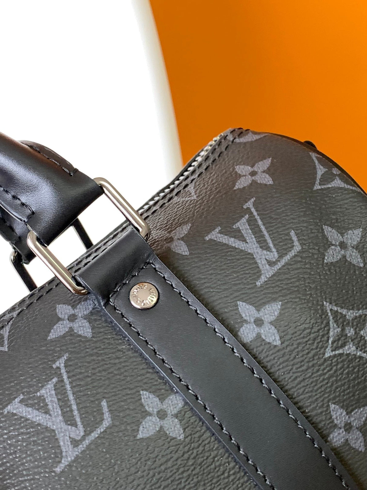 KEEPALL BANDOULIÈRE 25 IN BLACK MONOGRAM HERITAGE CANVAS