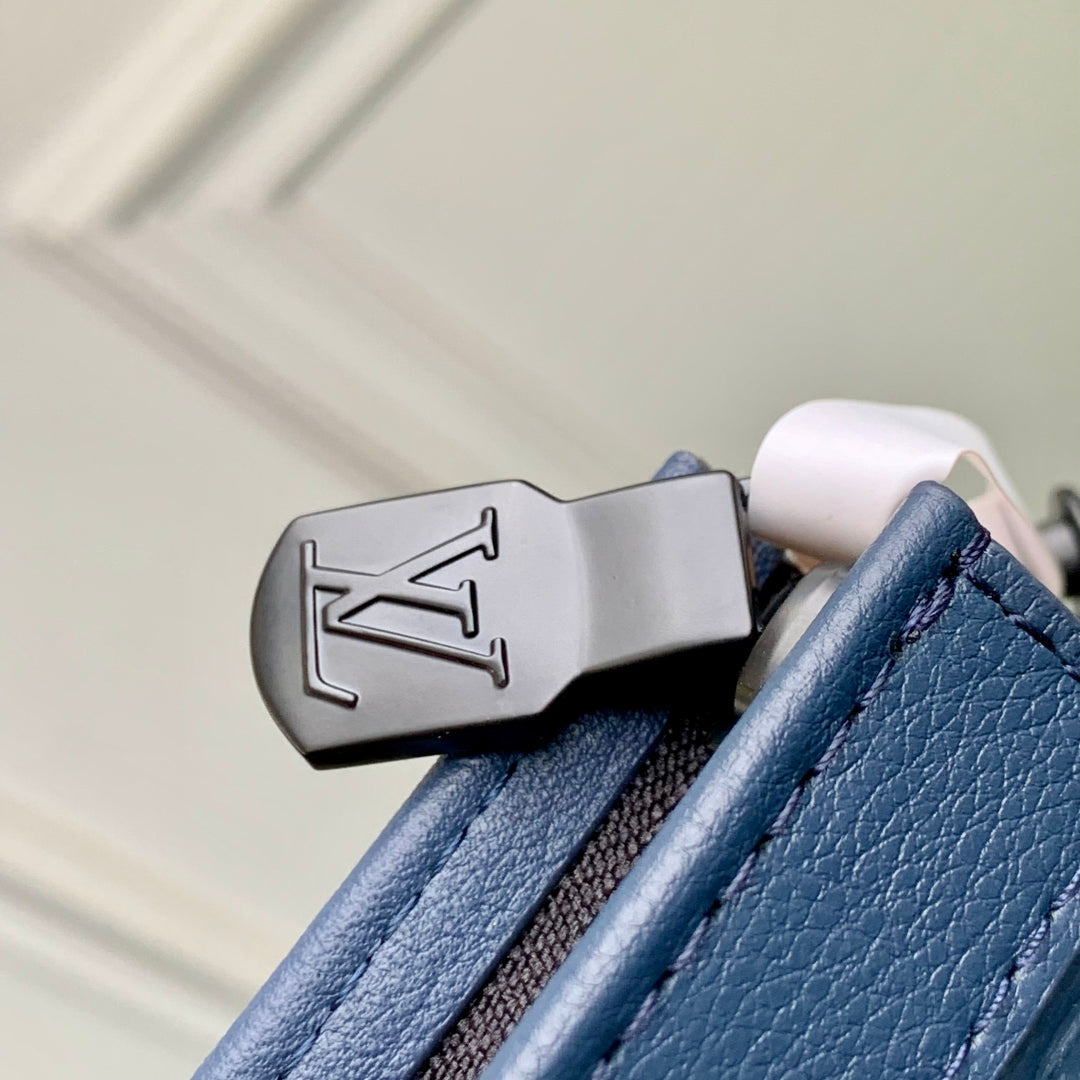 POCHETTE VOYAGE 27 IN DARK BLUE MONOGRAM ECLIPSE CALFSKIN EMBOSSED LOGO