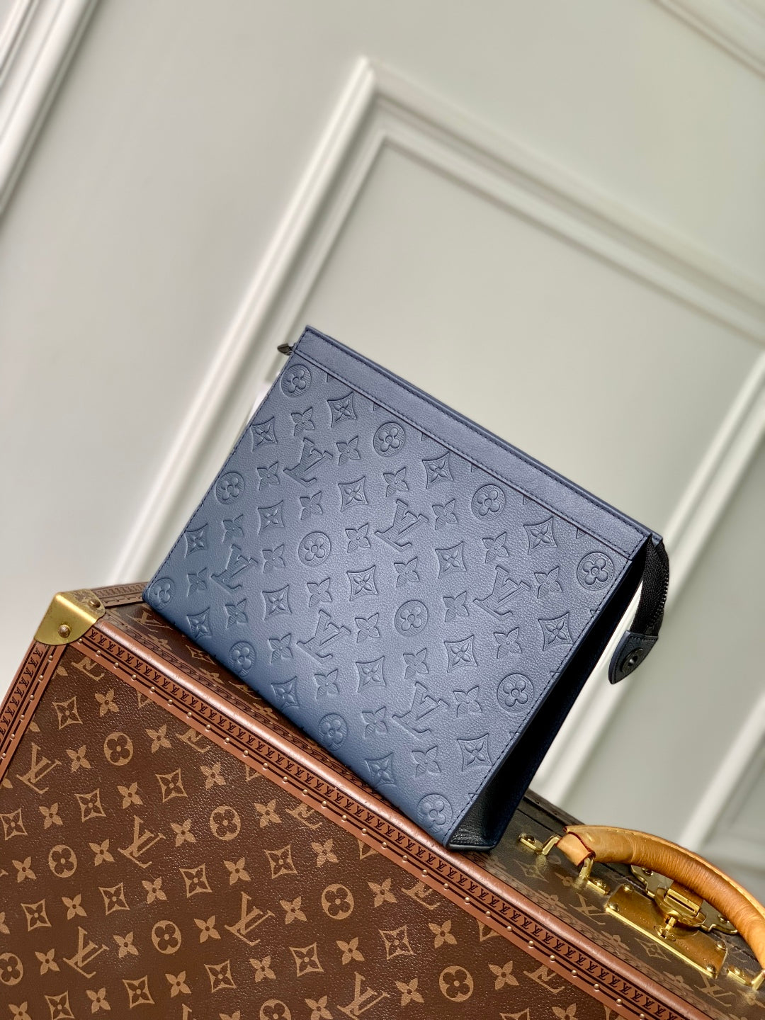 POCHETTE VOYAGE 27 IN DARK BLUE MONOGRAM ECLIPSE CALFSKIN EMBOSSED LOGO