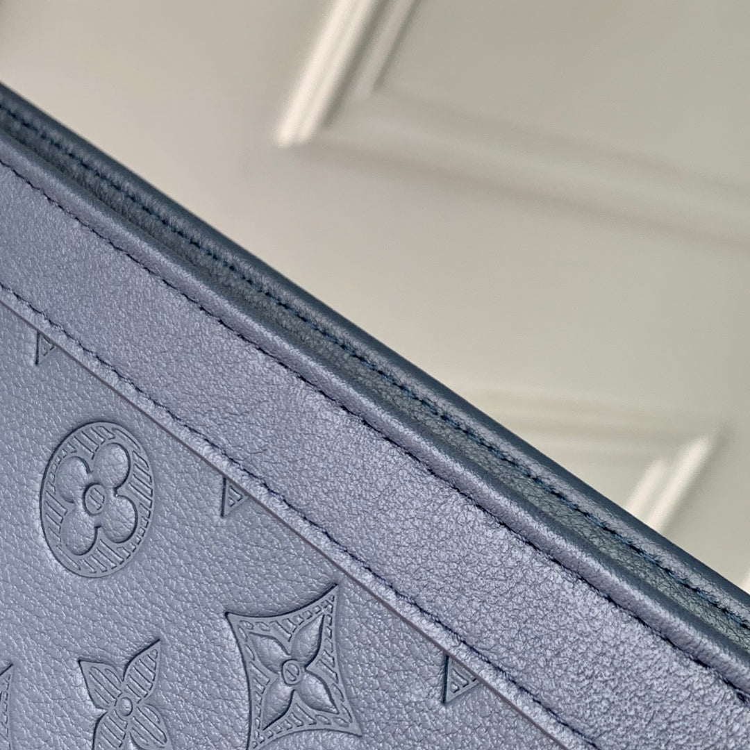 POCHETTE VOYAGE 27 IN DARK BLUE MONOGRAM ECLIPSE CALFSKIN EMBOSSED LOGO
