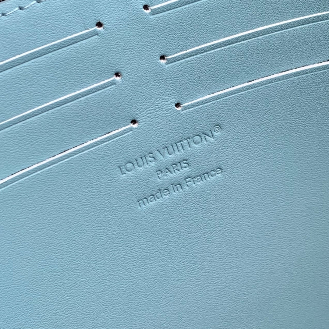 POCHETTE VOYAGE 26 IN SKY BLUE MONOGRAM ECLIPSE CALFSKIN