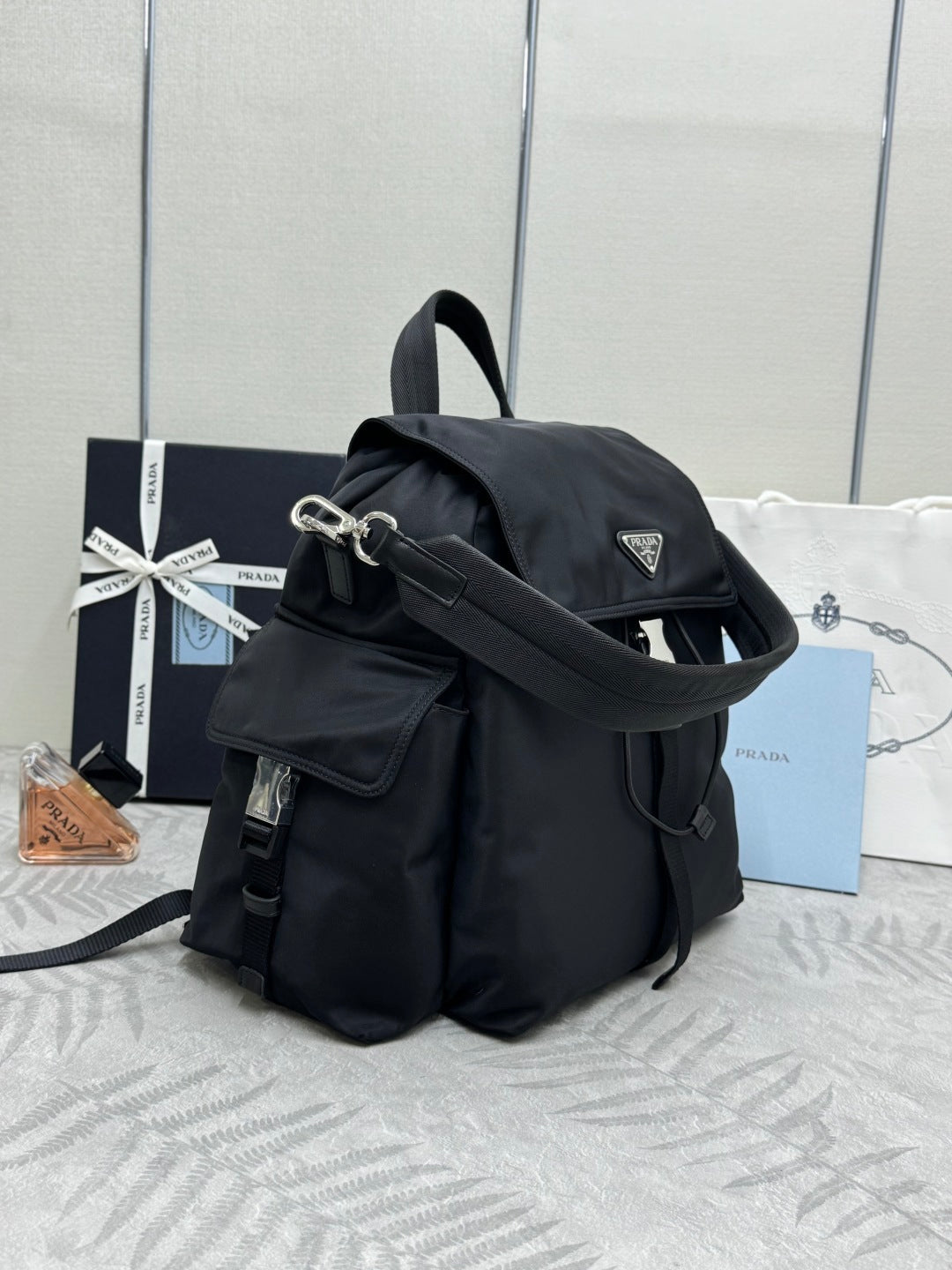 PRADA 25S EXPLORE BACKPACK 39 IN BLACK RE-NYLON AND CALFSKIN