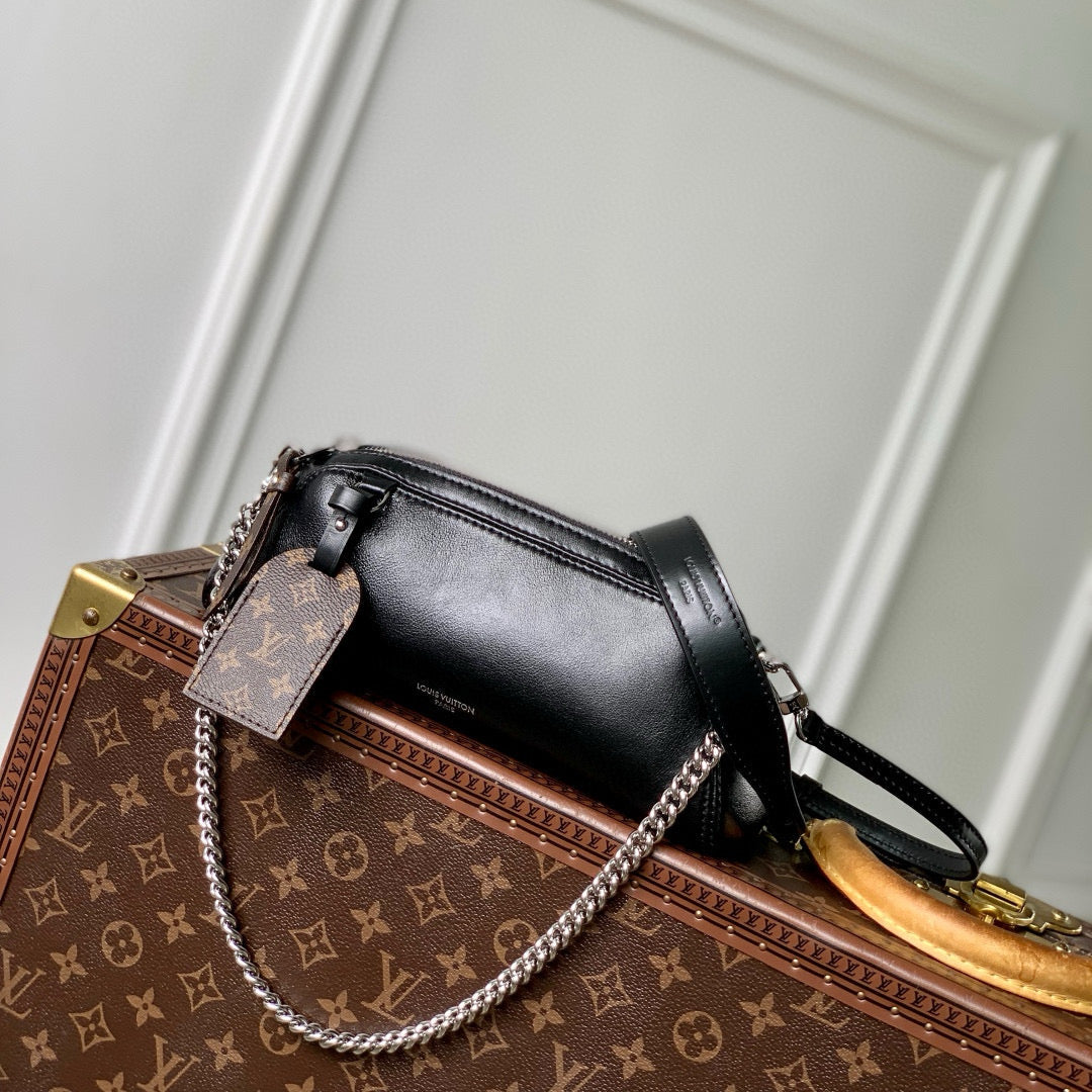 POCHETTE VIBE HANDBAG 25 IN BLACK LAMBSKIN BROWN COWHIDE AND COATED CANVAS TRIM