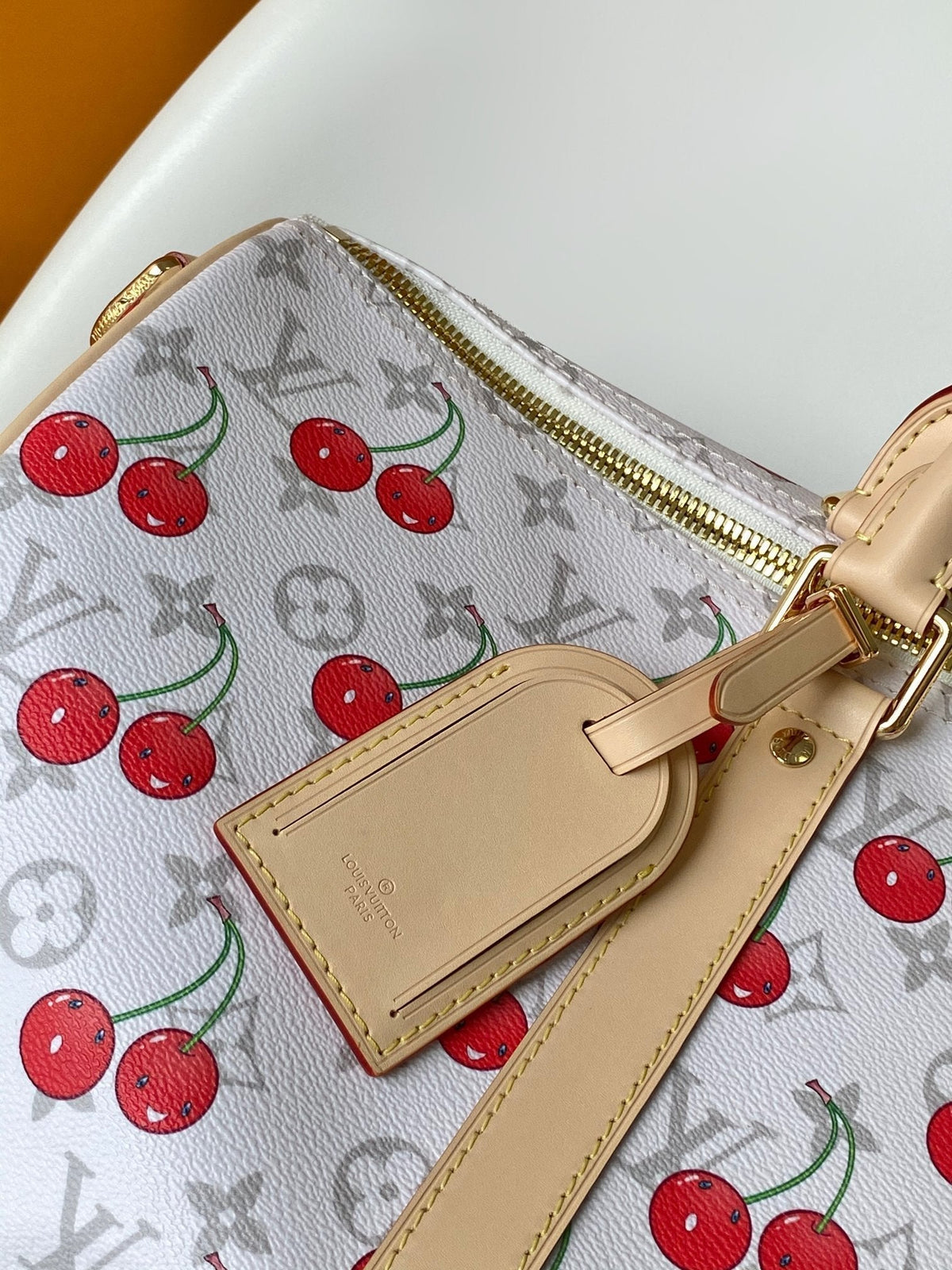 KEEPALL BANDOULIÈRE 45 IN WHITE AND RED CALFSKIN