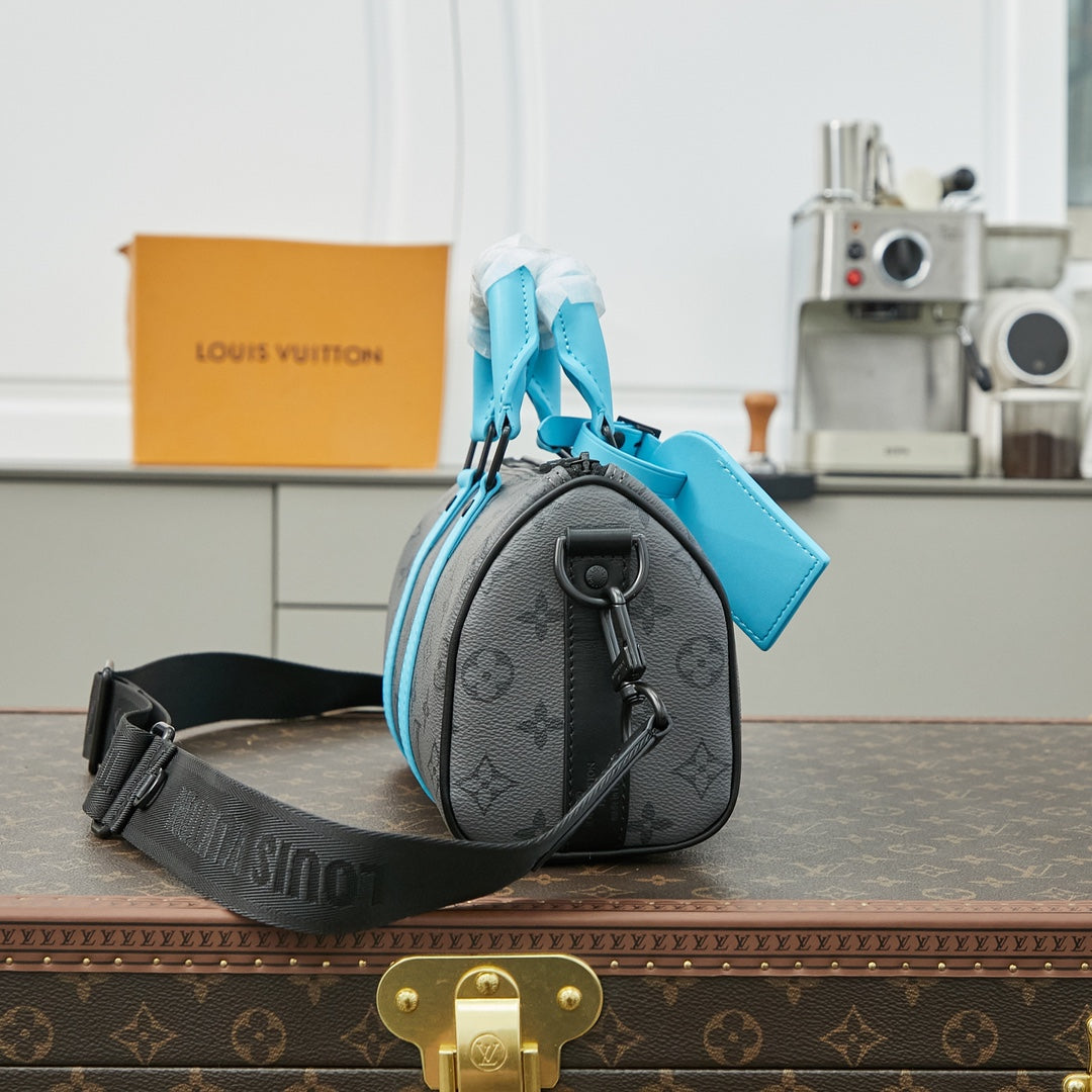 KEEPALL BANDOULIÈRE 25 IN GUN METAL MONOGRAM ECLIPSE CANVAS MIX TURQUOISE CALFSKIN