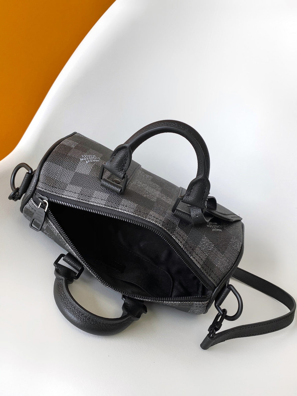 LV 25S KEEPALL BANDOULIÈRE 25 BAG IN DAMOFLAGE BLACK CALFSKIN